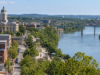 Regional briefing: official alerts, roads and community resources for September 23 Editorial illustration of a regional riverfront community